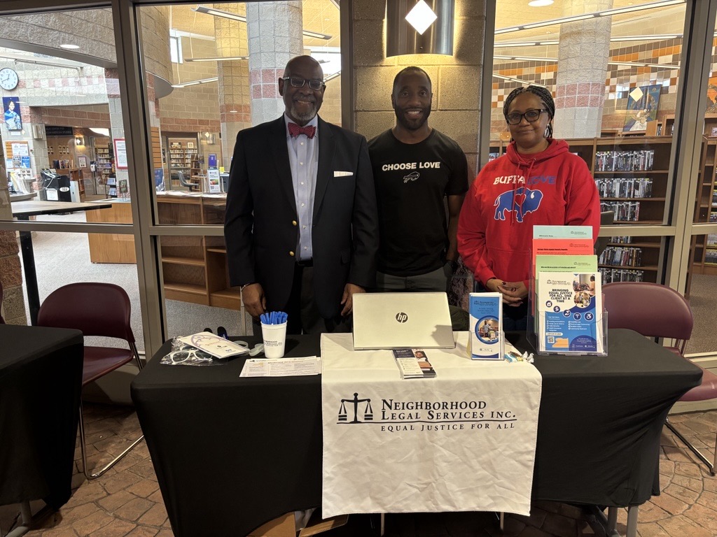 Three NLS team members at tabling event