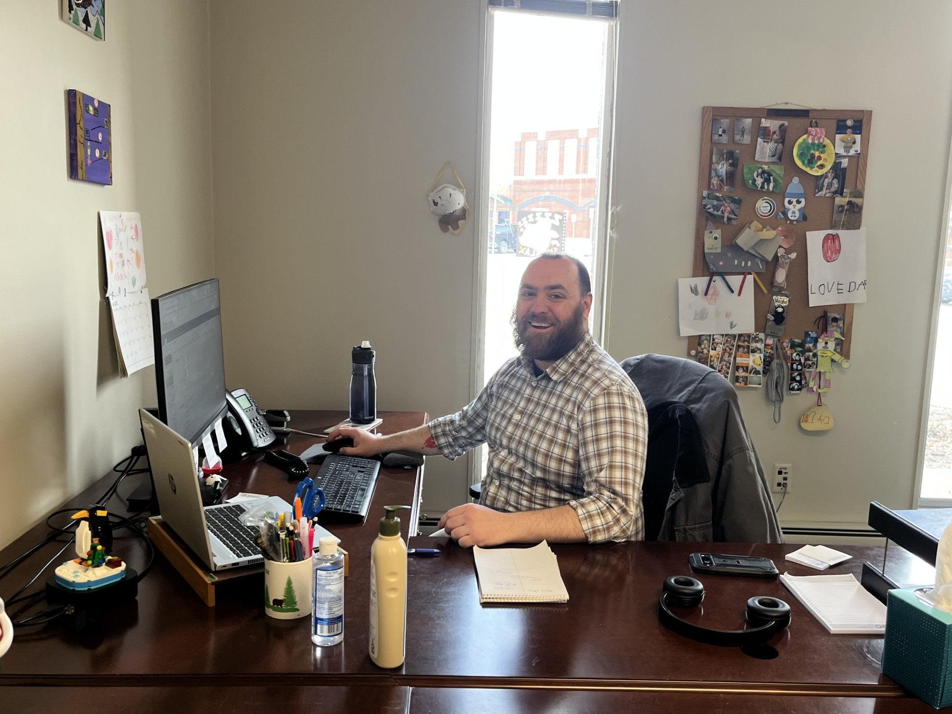 NLS team member sitting at desk
