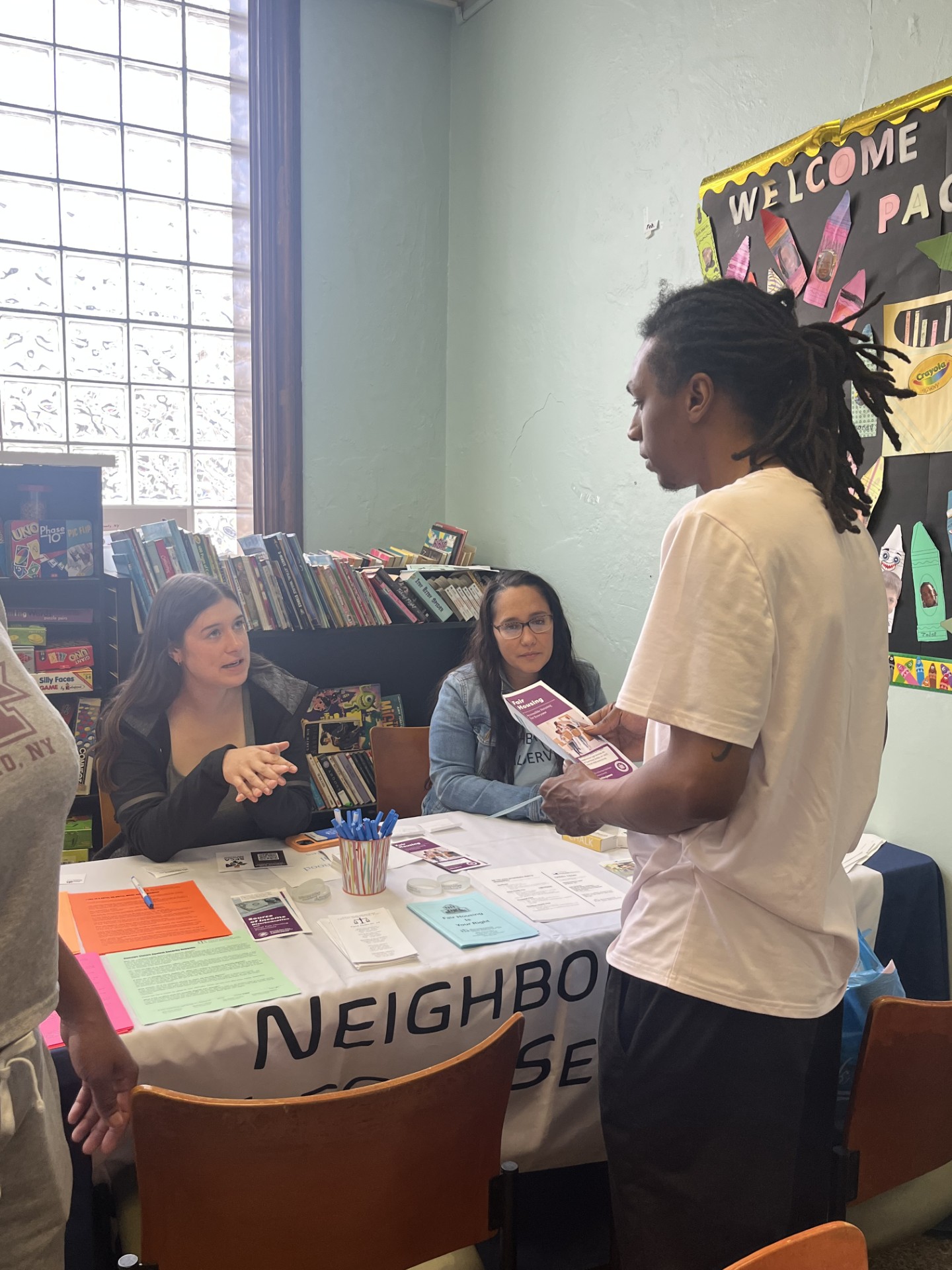 Team members at tabling event, handing out resources