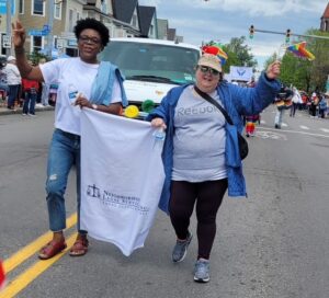 Two NLS team members walking in Buffalo Pride Parade
