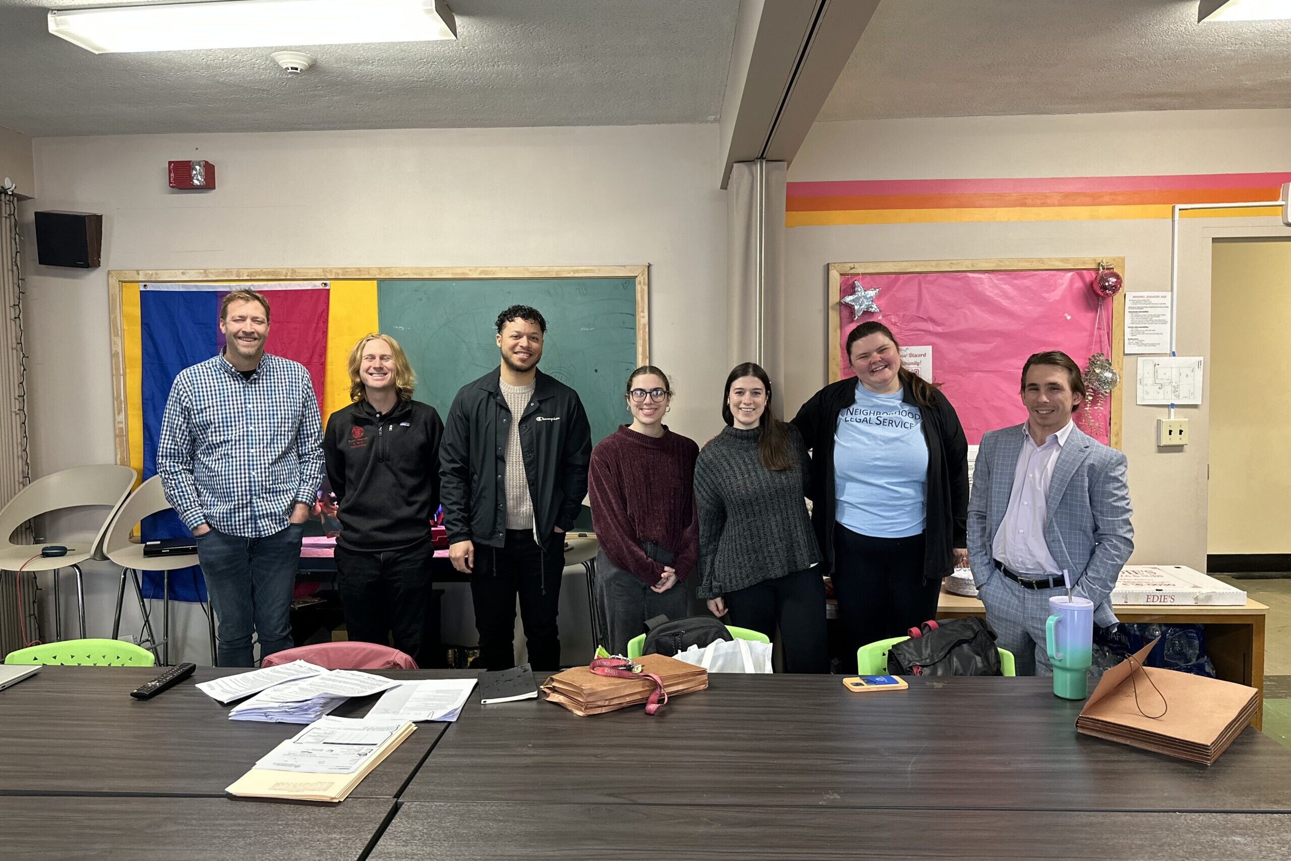 NLS team members standing together at a Name Change event