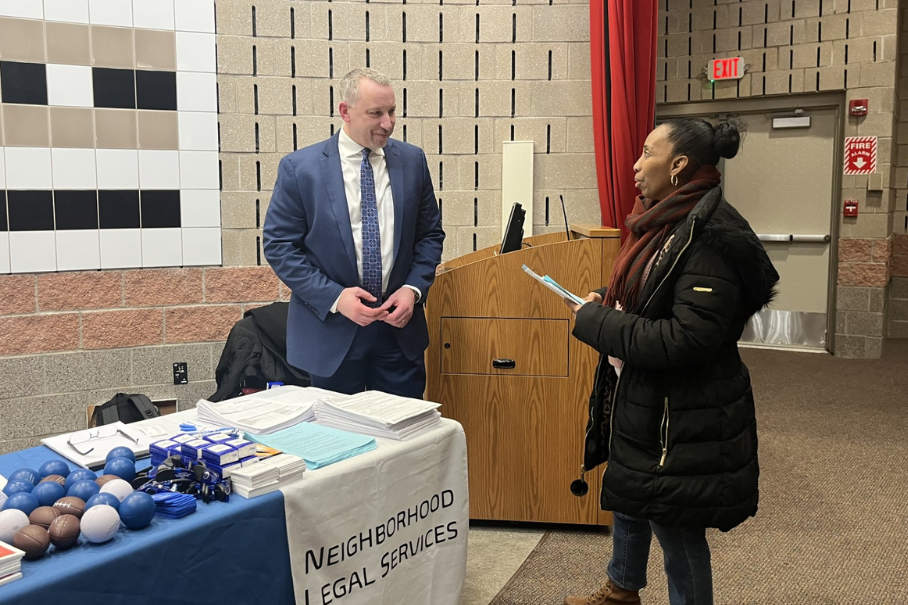 Todd providing information to a client at a Housing workshop presentation.