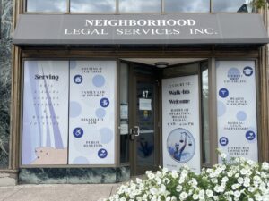 47 Court St office, Buffalo. Front door and windows with NLS logo and decals.
