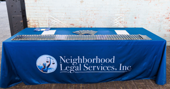 Table with blue tablecloth featuring the NLS logo.